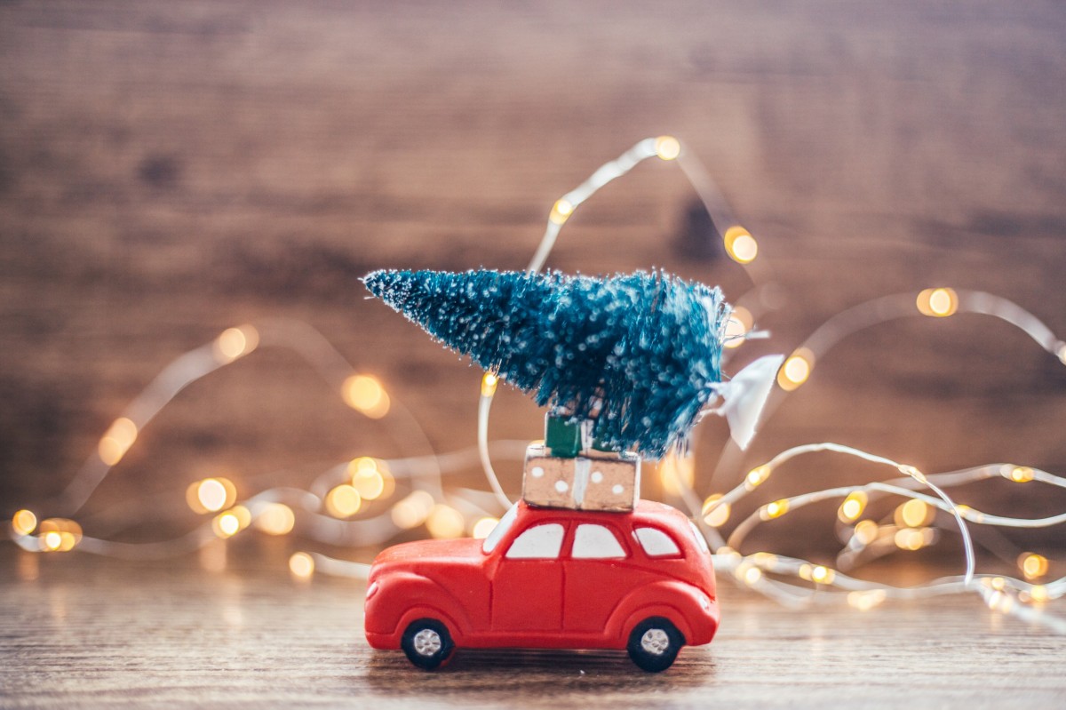 Small car with christmas tree on top 